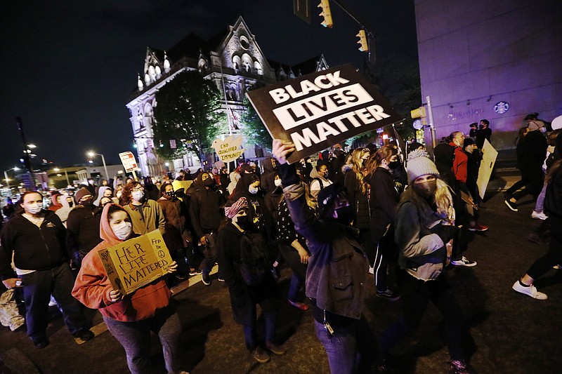 Associated Press photo / Protesters march in downtown Columbus, Ohio, on Tuesday after police shot and killed a teenage girl as she appeared to attempt to stab two people with a knife just as the verdict was being announced in the trial for the killing of George Floyd.
