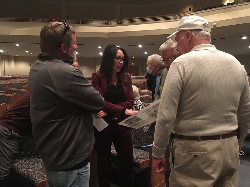 Staff photo by Mary Fortune / Hamilton County Commissioner Sabrena Smedley, center, talks with constituents about property appraisals on Friday evening at East Brainerd Church of Christ.