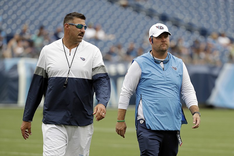 AP file photo by Mark Humphrey / Tennessee Titans coach Mike Vrabel, left, and general manager Jon Robinson will try to make the most of their No. 22 overall pick in the first round of the NFL draft, which starts Thursday night in Cleveland.