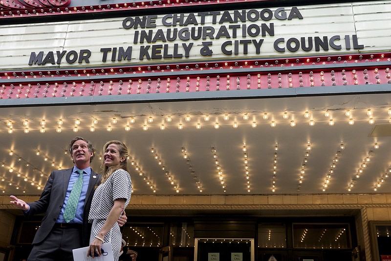 Staff photo by C.B. Schmelter / Mayor Tim Kelly, left, gestures as he and his wife Ginny Kelly pose for pictures following the Chattanooga inauguration ceremony at the Tivoli Theatre on Monday, April 19, 2021.