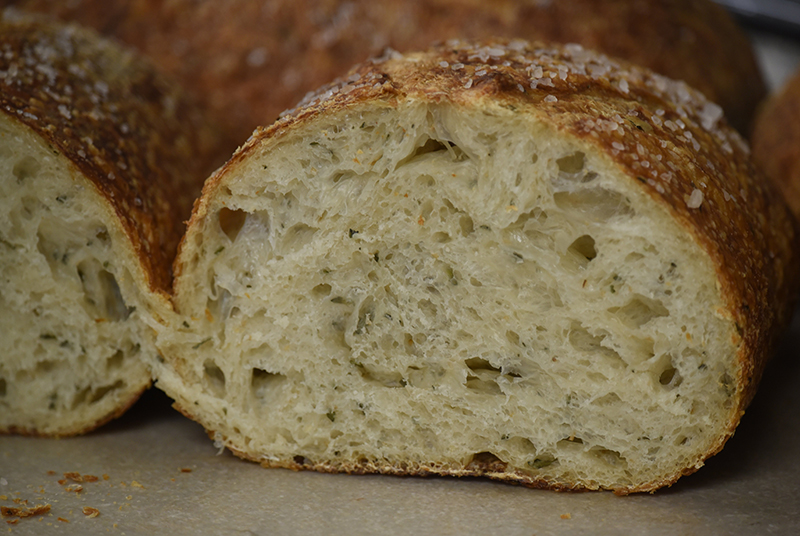 Staff photo by Matt Hamilton / A loaf of rosemary sourdough made by chef Dane Frazier at St. John's restaurant.