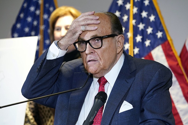 FILE - In this Nov. 19, 2020, file photo, former New York Mayor Rudy Giuliani, who was a lawyer for President Donald Trump, speaks during a news conference at the Republican National Committee headquarters in Washington. A law enforcement official tells the Associated Press that federal investigators have executed a search warrant at Rudy Giuliani's Manhattan residence. The former New York City mayor has been under investigation for several years over his business dealings in Ukraine. (AP Photo/Jacquelyn Martin, File)