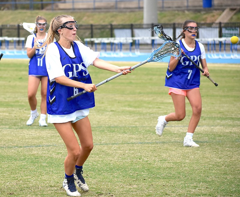 Staff photo by Patrick MacCoon / GPS senior midfielder Annie Sanford shoots during Thursday's practice. The Bruisers have averaged more than 17 goals per game this season and are 15-0 heading into the state playoffs next week.