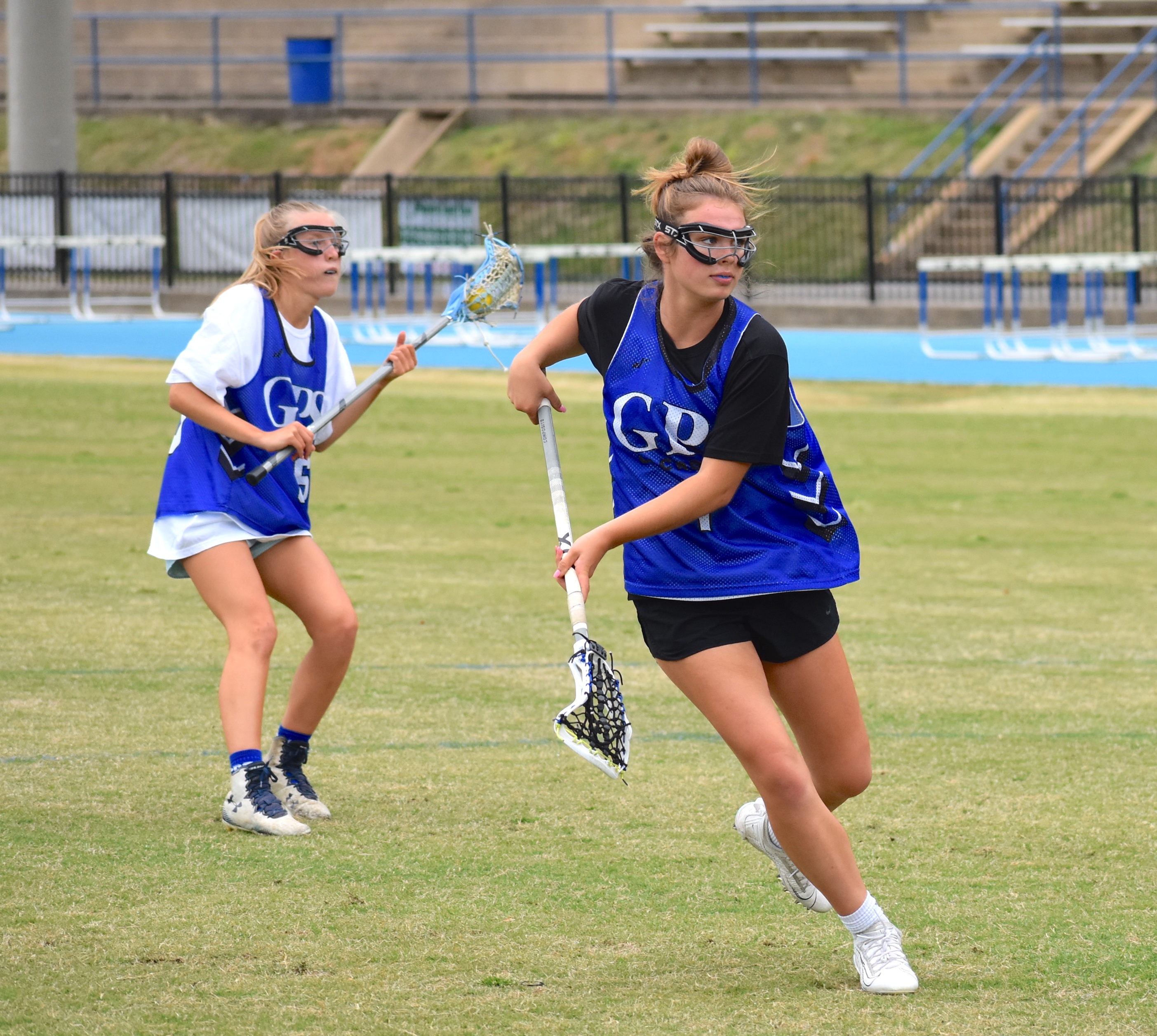 Staff photo by Patrick MacCoon / GPS attacker Anna Beth Coffman follows through on a shot at practice Thursday. Coffman and fellow seniors Kenzie Grisar and Annie Sanford are team captains for the Bruisers.