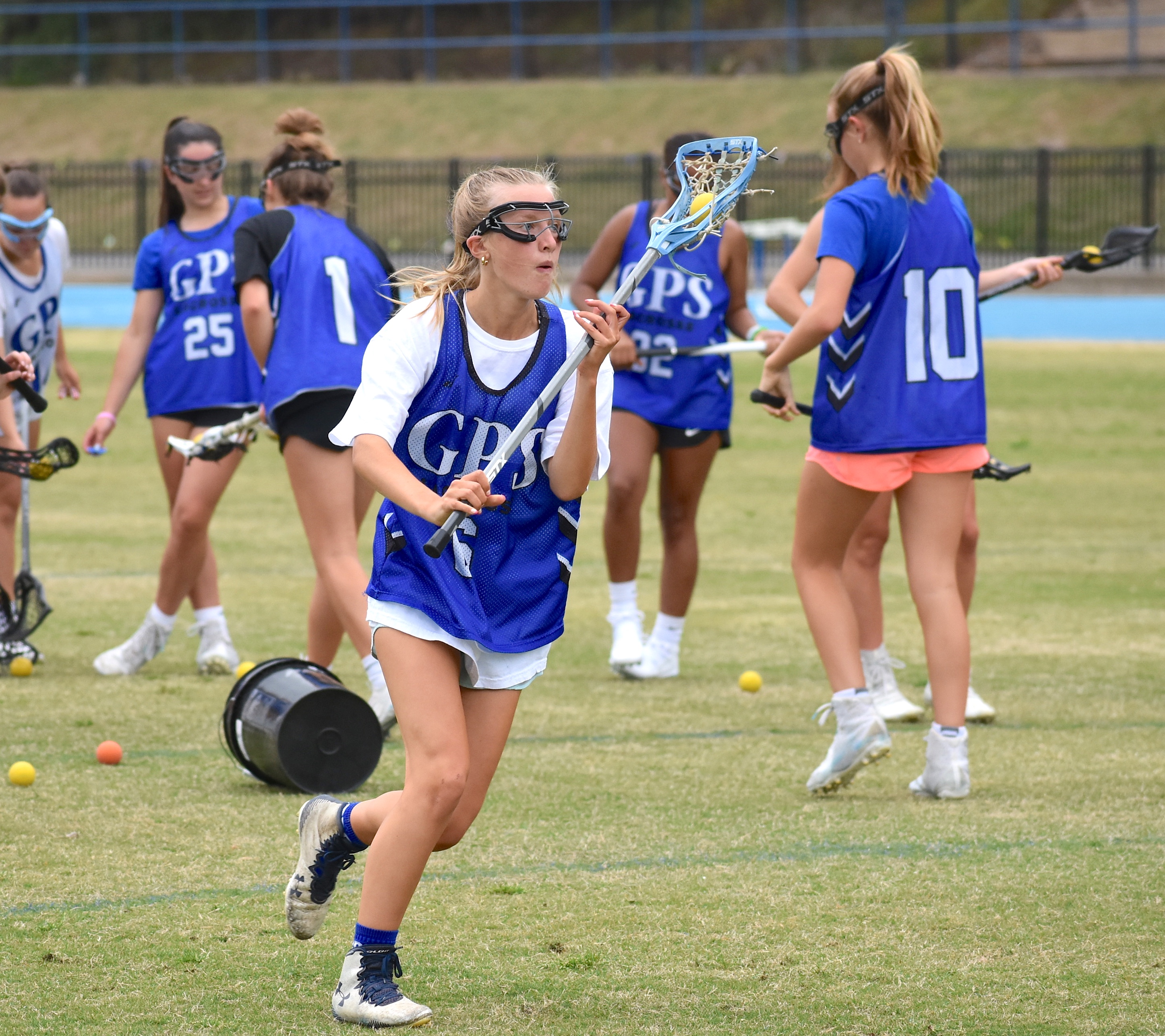 Staff photo by Patrick MacCoon / GPS senior Annie Sanford practices her attack during Thursday's lacrosse practice.