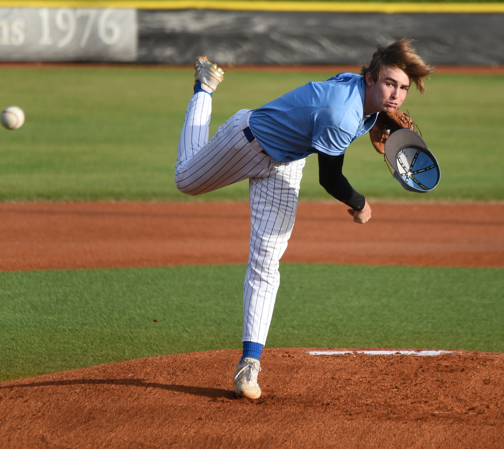 Staff Photo by Matt Hamilton / McCallie (6) Austin Breedlove loses his hat as he fires a pitch on Friday, April 30, 2021 at the McCallie School.