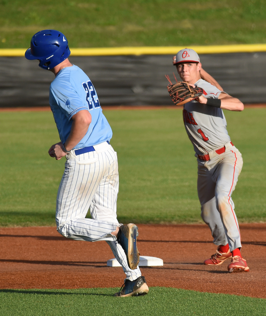 Staff Photo by Matt Hamilton / McCallie (22) Carter Hewett veers off as Ooltewah (1) Bryson Smith tags second and throws to first for the double play on Friday, April 30, 2021 at the McCallie School.