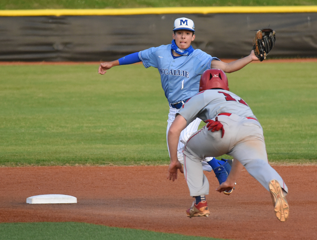 Staff Photo by Matt Hamilton / Ooltewah (17) Isaac Hughes slides in safe at second as McCallie (1) Sebastian Leinberger has to come off the bag for the throw on Friday, April 30, 2021 at the McCallie School.