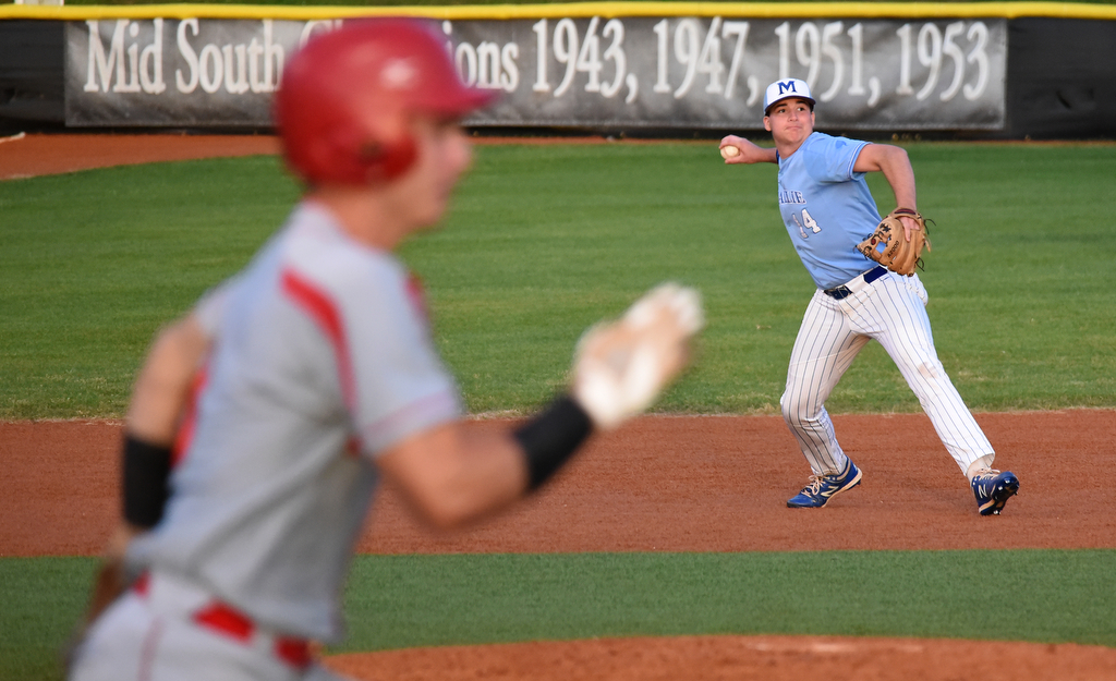 Staff Photo by Matt Hamilton / McCallie (14) Hogan Jones fires a throw to first for the out on Friday, April 30, 2021 at the McCallie School.