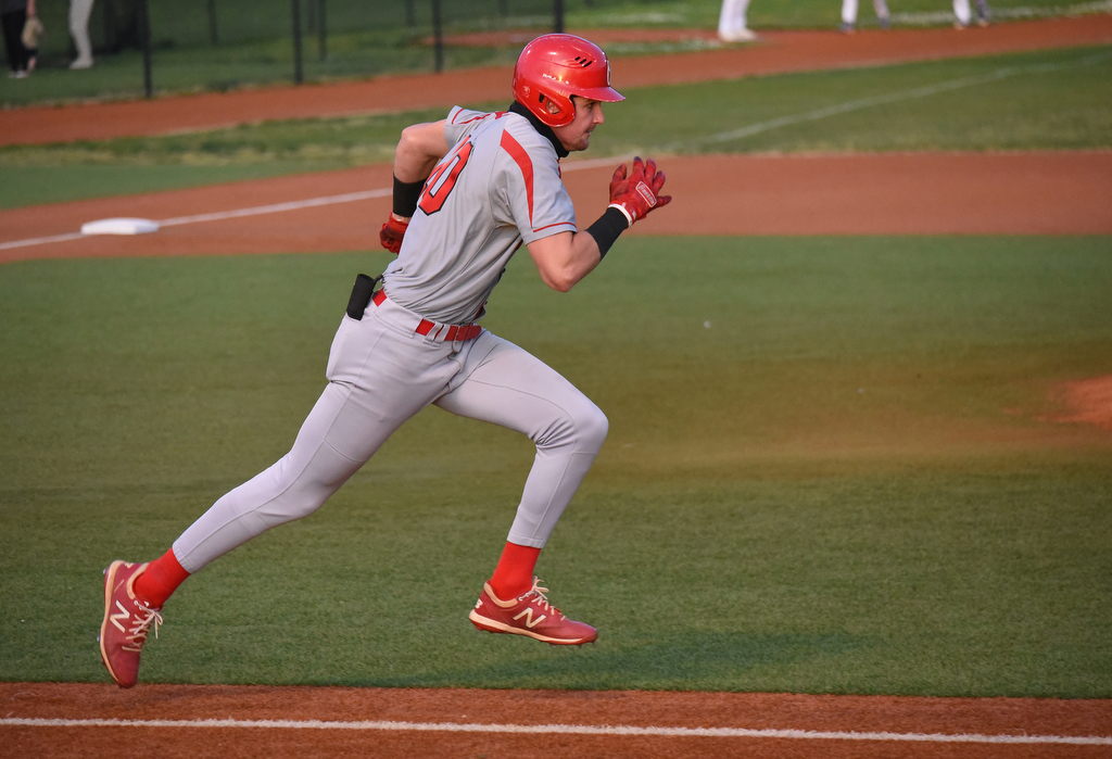 Staff Photo by Matt Hamilton / Ooltewah (10) Dominic Mackaluso runs toward first on Friday, April 30, 2021 at the McCallie School.