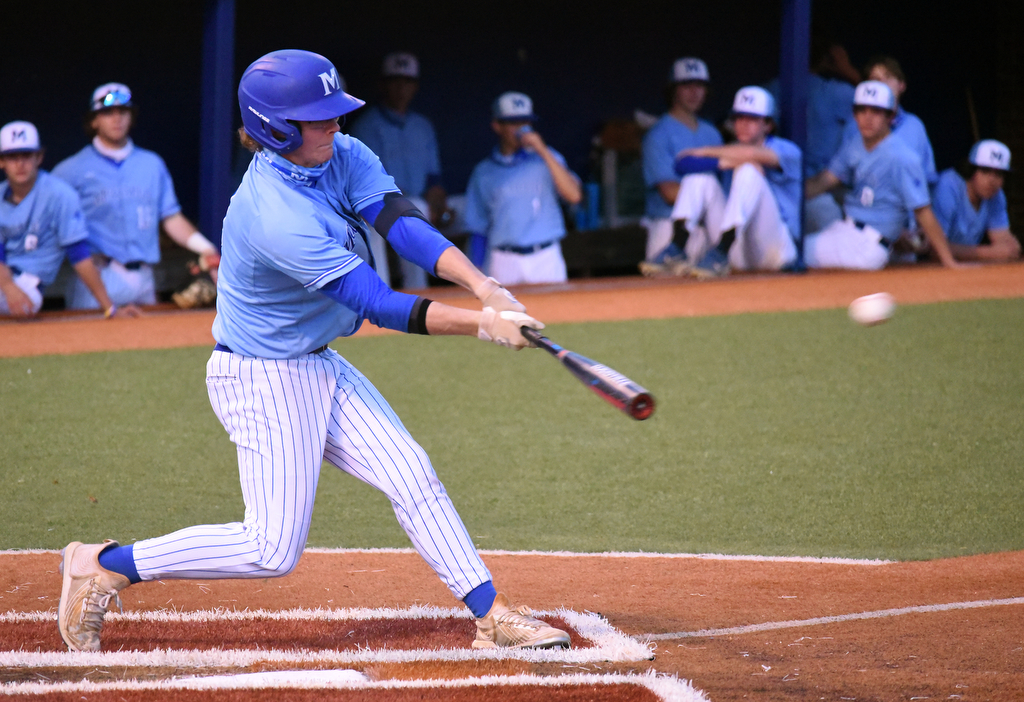 Staff Photo by Matt Hamilton / McCallie (11) Kyle Berry connects with a pitch on Friday, April 30, 2021 at the McCallie School.