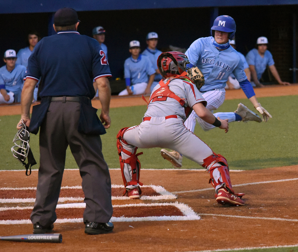 Staff photo by Matt Hamilton / Ooltewah catcher Andrew Zettel tags McCallie's Kyle Berry out at home during Friday's game at McCallie. Ooltewah won 6-5 in 11 innings.