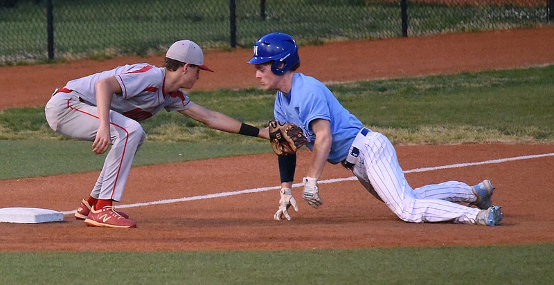 Staff photo by Matt Hamilton / Ooltewah's Bryson Smith tags McCallie's Nolan Sergeant as he slides into third base during Friday's game at McCallie.