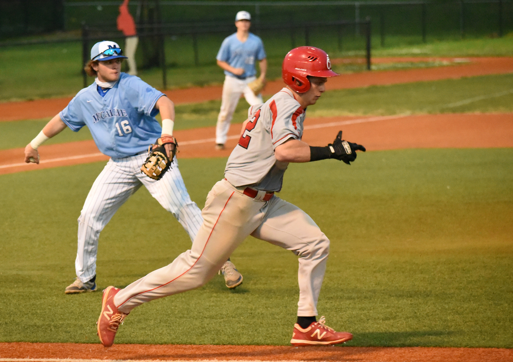 Staff Photo by Matt Hamilton / McCallie (16) Gray Glover fields a bunt and throws Ooltewah (22) Noah Huling out on Friday, April 30, 2021 at the McCallie School.