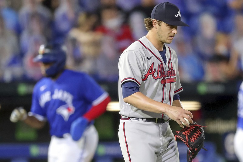 AP photo by Mike Carlson / Atlanta Braves reliever Jacob Webb reacts after giving up a three-run homer to the Toronto Blue Jays' Teoscar Hernandez during the sixth inning of Friday night's game in Dunedin, Fla.