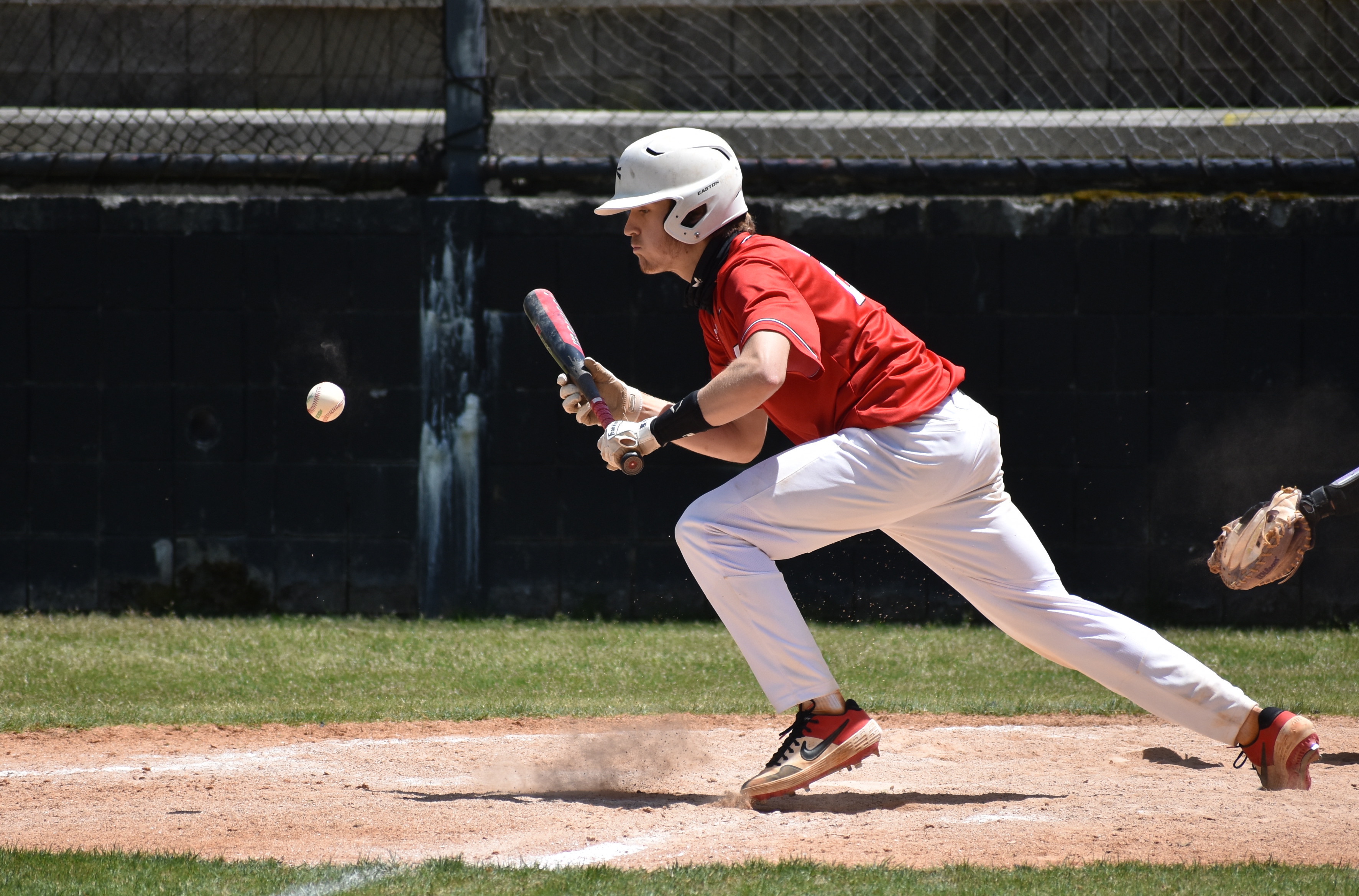Staff photo by Patrick MacCoon / Signal Mountain junior Logan Farr lays down a bunt single during the fifth inning of Saturday's 6-4 home victory over Sequatchie County.