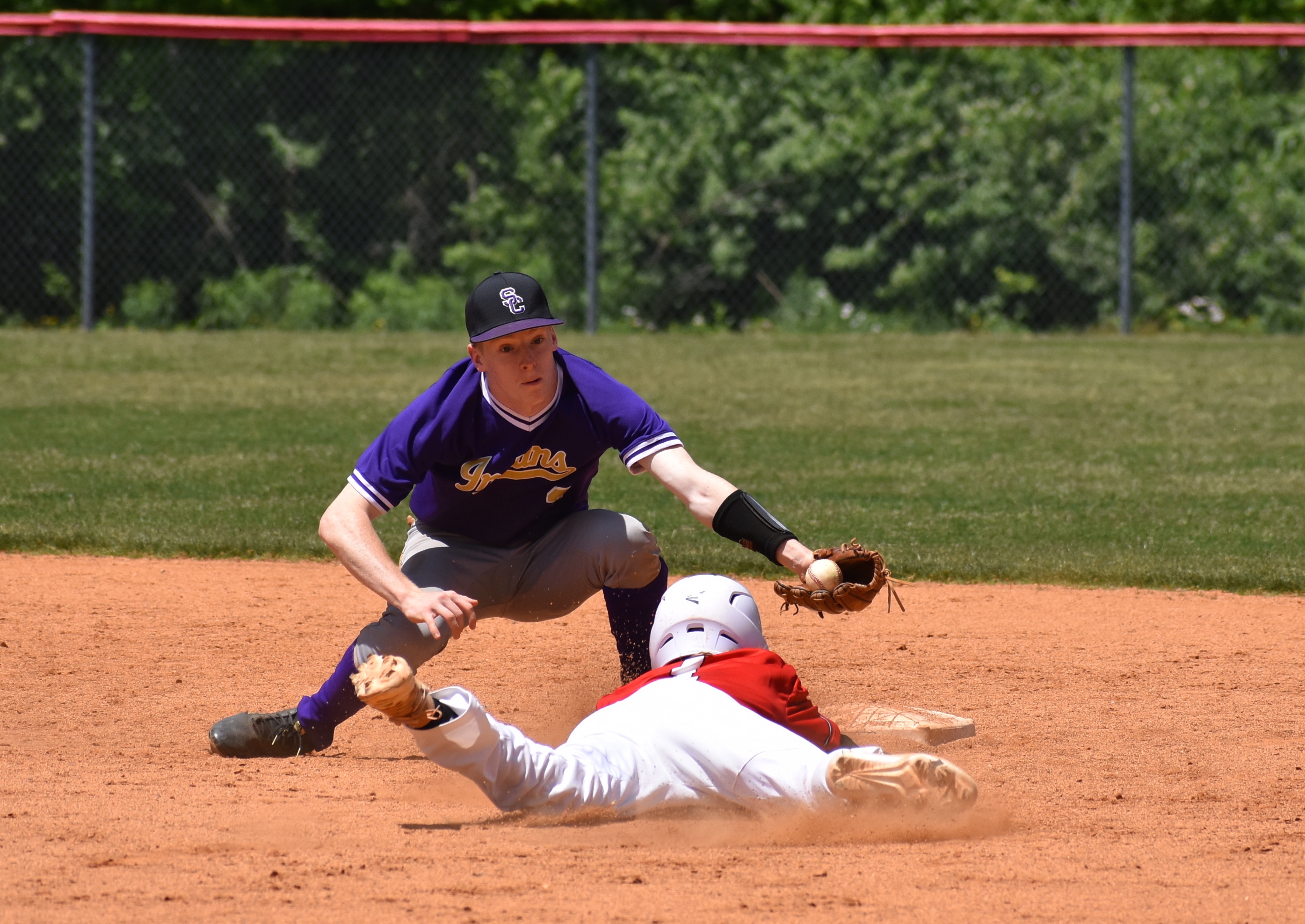 Staff photo by Patrick MacCoon / Sequatchie County's Ethan Seals makes a nice scoop to apply the tag on a Signal Mountain baserunner Saturday.