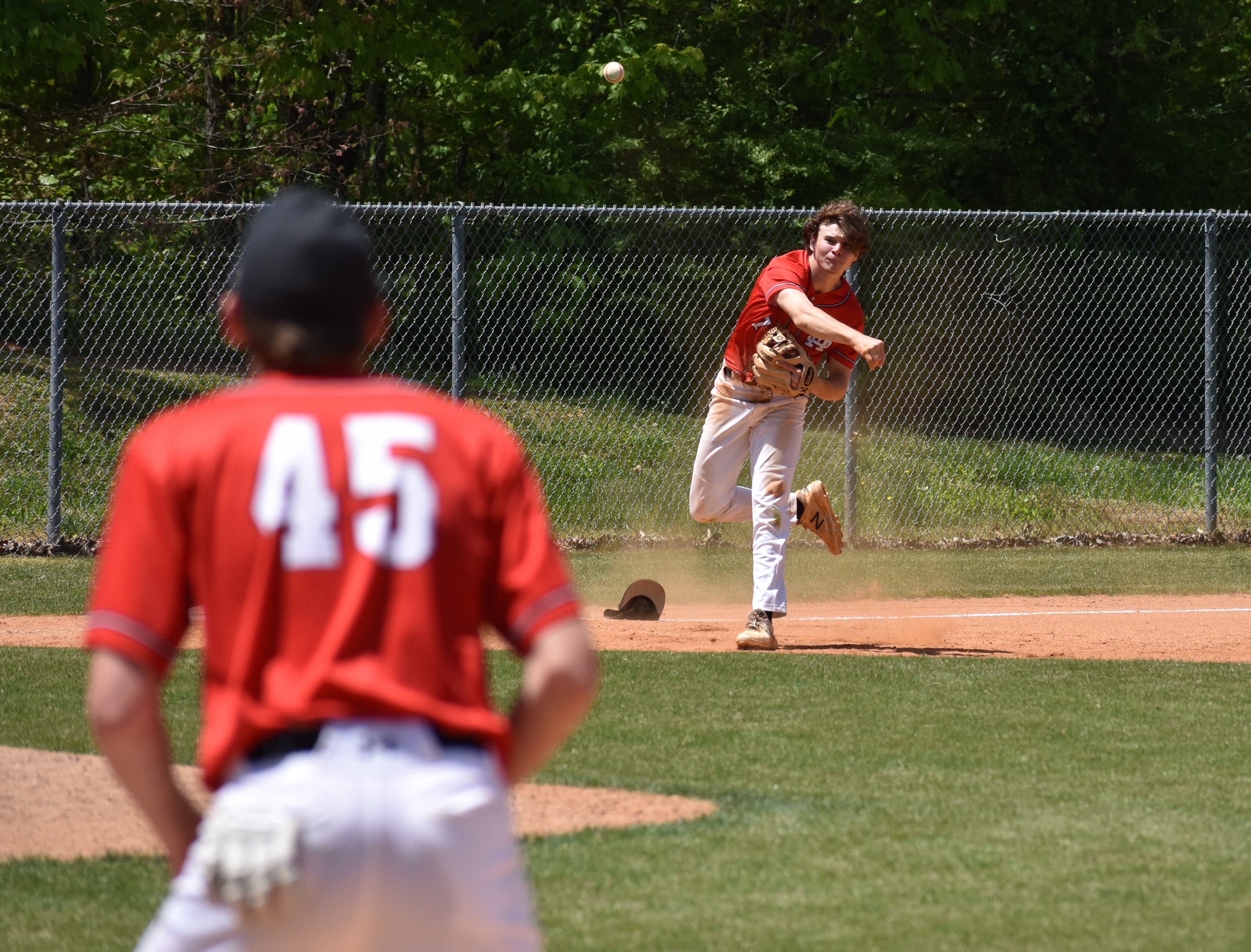 Staff photo by Patrick MacCoon / Signal Mountain third baseman Preston Worley fires the ball to first after a nice diving stop to take a Sequatchie County hit away on Saturday.