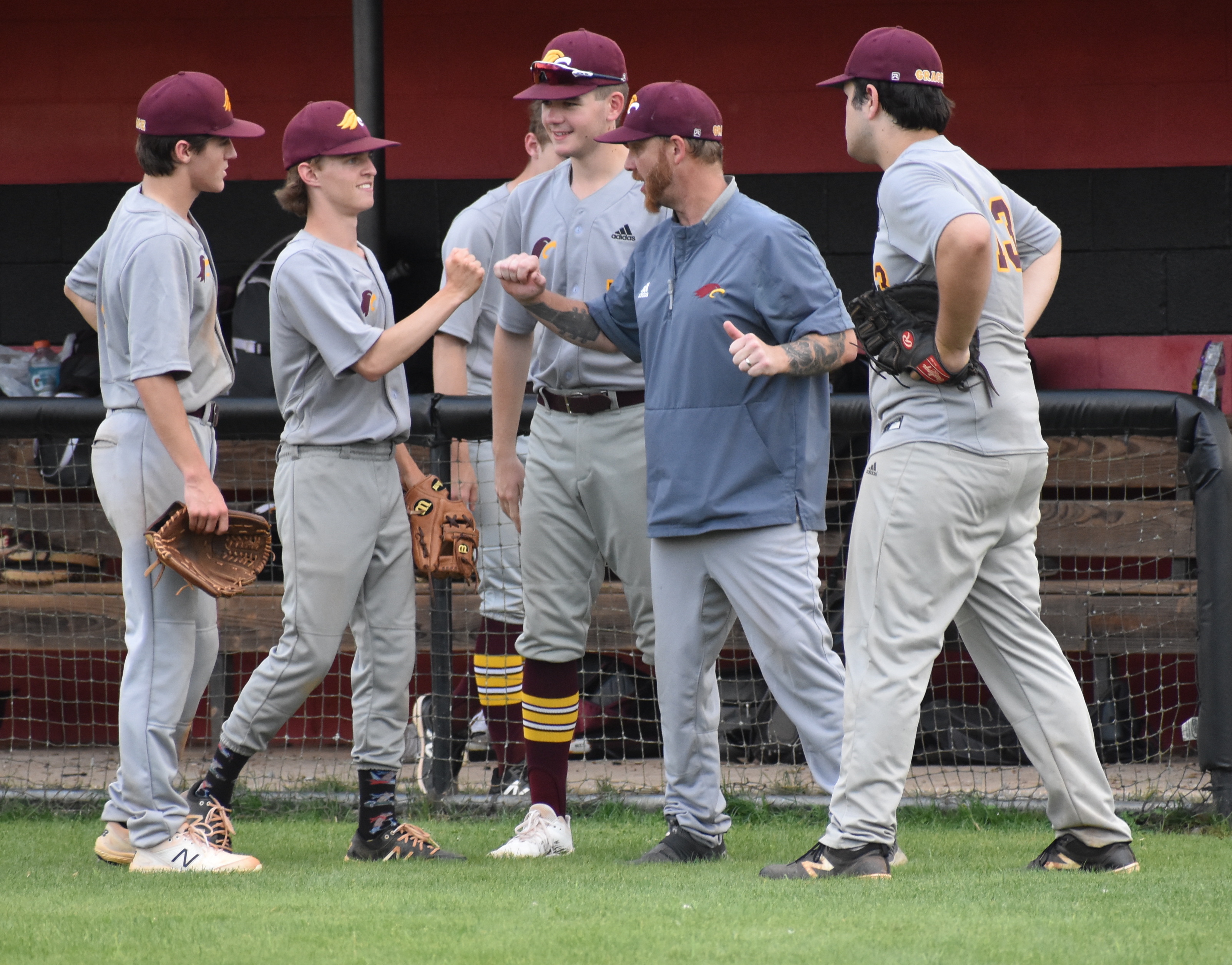 Staff photo by Patrick MacCoon / Grace Baptist Academy head baseball coach Adam Brumlow talks to his players between innings Monday at Whitwell HIgh School.