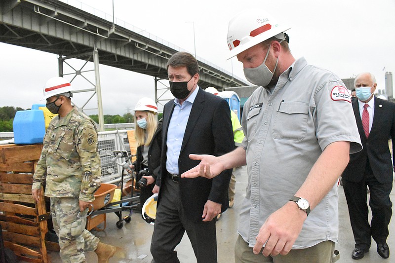 Staff Photo by Matt Hamilton / Lt. Col. Sonny Avichal, left, and Lockmaster Cory Richardson, right, tour the Chickamauga Lock with Senator Bill Hagerty, middle, in Chattanooga on Tuesday, May 4, 2021. 