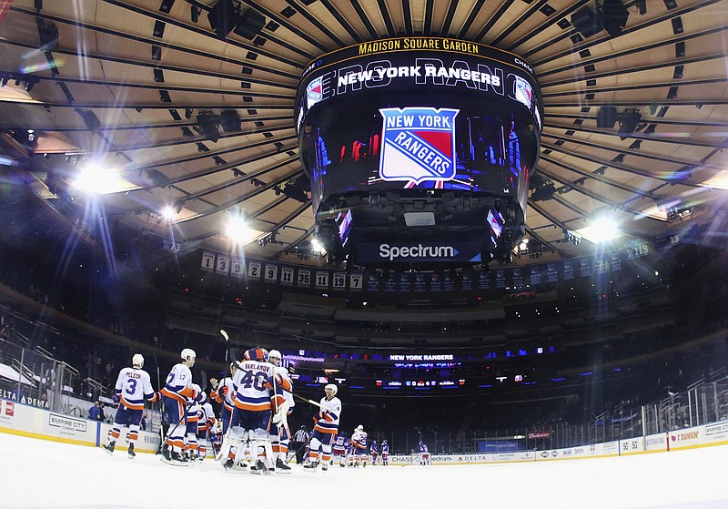 The New York Islanders celebrate a shutout against the New York Rangers in an NHL hockey game Thursday, April 29, 2021, in New York. (Bruce Bennett/Pool Photo via AP)
