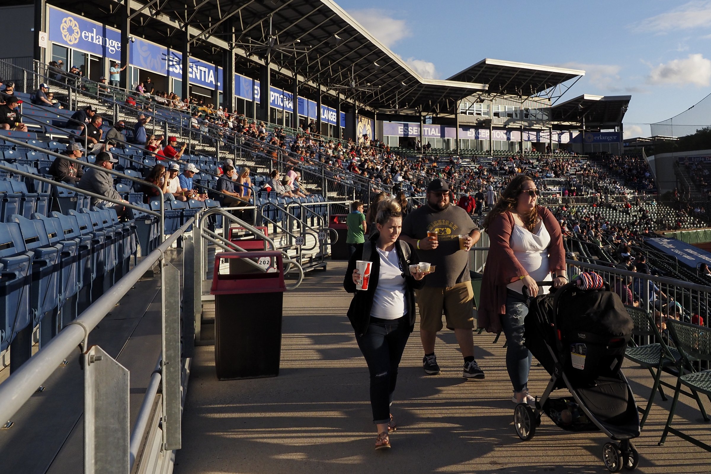 Staff photo by C.B. Schmelter / Fans make their way to their seats during a game between the Chattanooga Lookouts and the Rocket City Trash Pandas at AT&T Field on Wednesday, May 5, 2021 in Chattanooga, Tenn. After having their 2020 season cancelled due to the coronavirus pandemic, and having their opening day game postponed due to weather the previous day, the Chattanooga Lookouts hosted the River City Trash Pandas for their first home game in over 600 days.