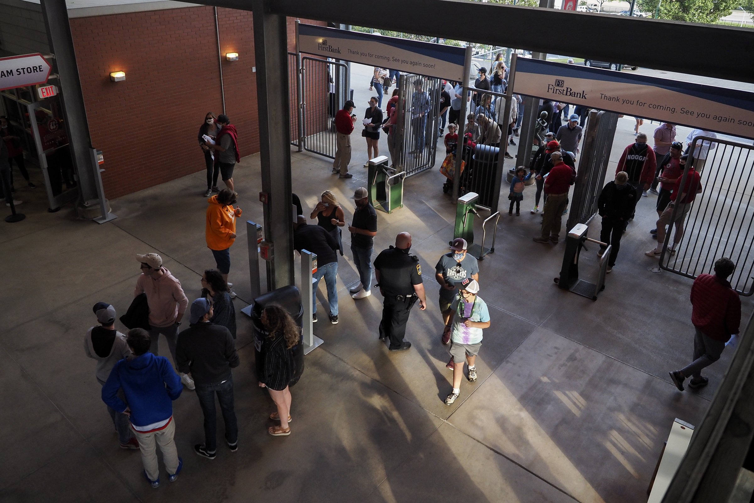 Staff photo by C.B. Schmelter / Fans make their way into AT&T Field for the a game between the Chattanooga Lookouts and the River City Trash Pandas on Wednesday, May 5, 2021 in Chattanooga, Tenn. After having their 2020 season cancelled due to the coronavirus pandemic, and having their opening day game postponed due to weather the previous day, the Chattanooga Lookouts hosted the River City Trash Pandas for their first home game in over 600 days.