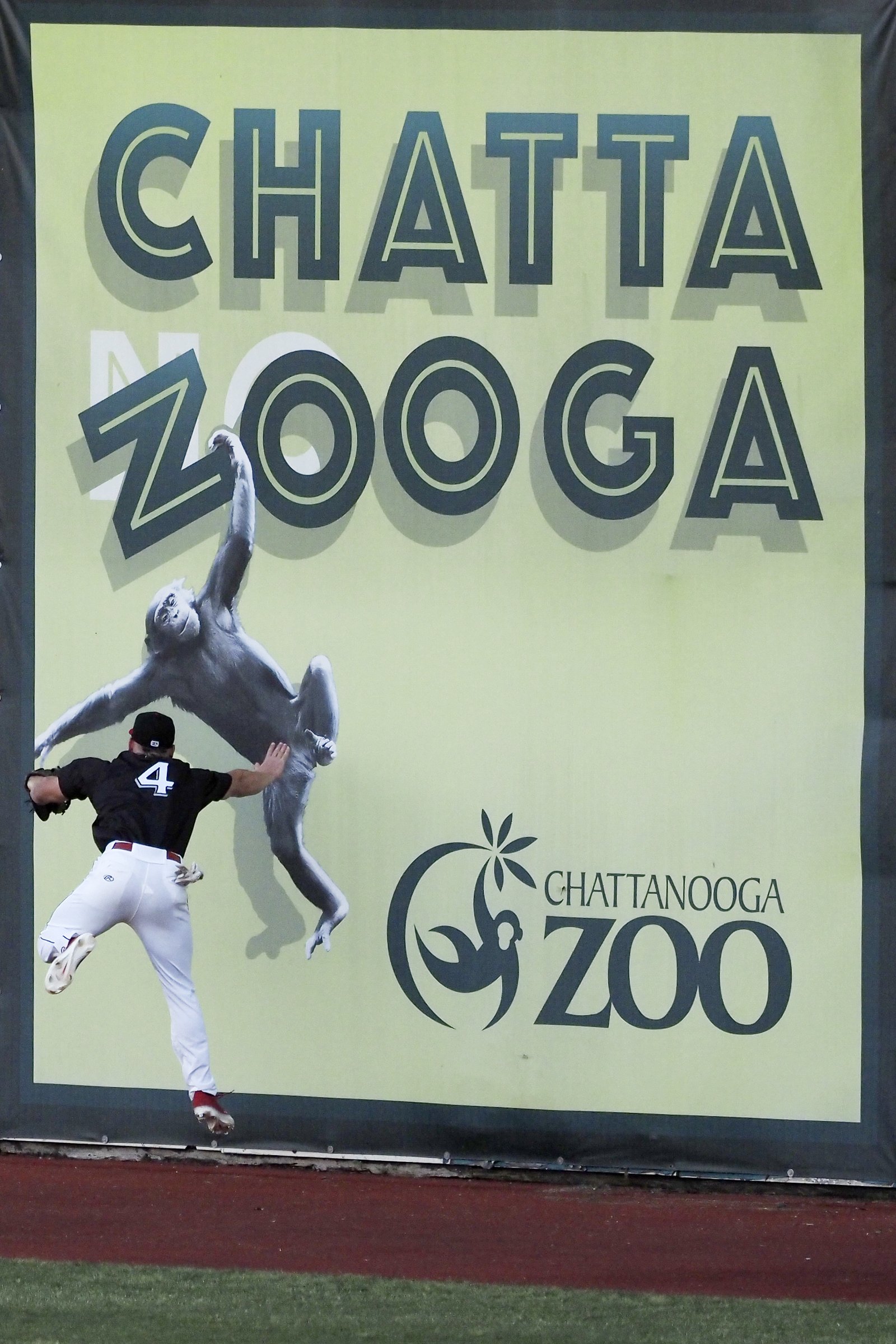 Staff photo by C.B. Schmelter / Chattanooga Lookouts left fielder Drew Mount (4) makes a leaping grab against the River City Trash Pandas at AT&T Field on Wednesday, May 5, 2021 in Chattanooga, Tenn. After having their 2020 season cancelled due to the coronavirus pandemic, and having their opening day game postponed due to weather the previous day, the Chattanooga Lookouts hosted the River City Trash Pandas for their first home game in over 600 days.