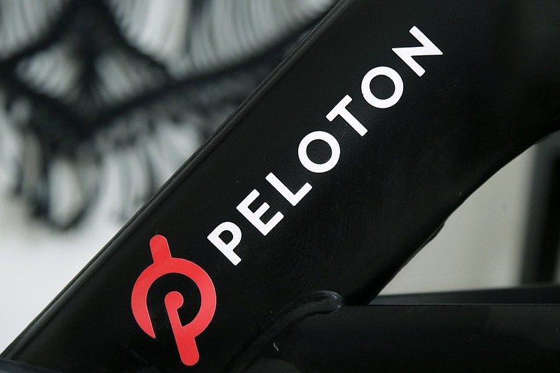 FILE - This Nov. 19, 2019 file photo shows a Peloton logo on the company's stationary bicycle in San Francisco. Peloton is recalling its treadmills after one child died and 29 other children suffered from cuts, broken bones and other injuries from being pulled under the rear of the treadmill. The U.S. Consumer Product Safety Commission said Wednesday, May 5, 2021, that Peloton received 72 reports of adults, kids, pets or other items, such as exercise balls, being pulled under the treadmill. (AP Photo/Jeff Chiu, File)

