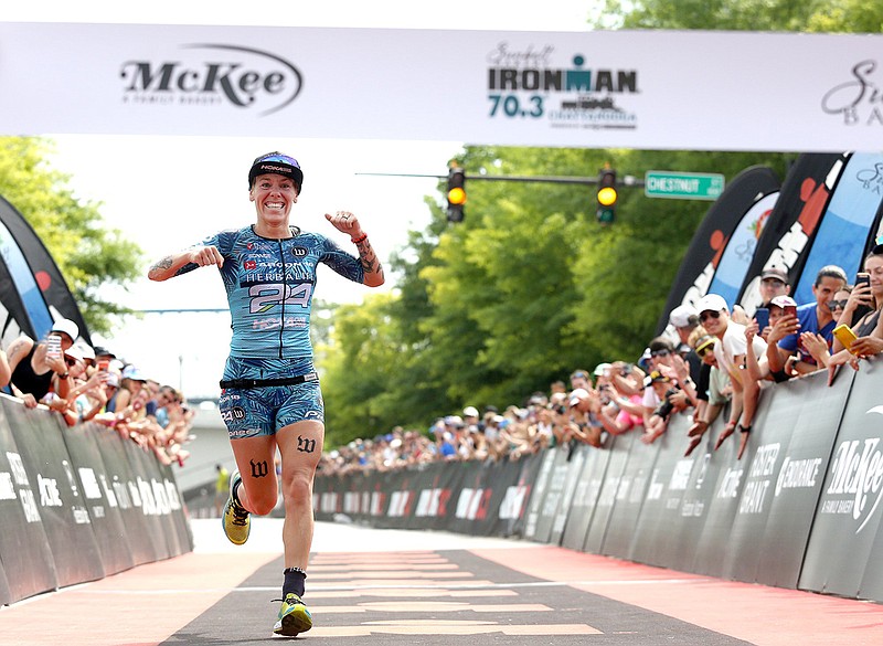 Staff photo / Heather Jackson celebrates as she crosses the finish line in first place for the pro women's division of the 2019 Sunbelt Bakery Ironman 70.3 Chattanooga. Jackson finished with a time of 4 hours, 14 minutes, 25 seconds.