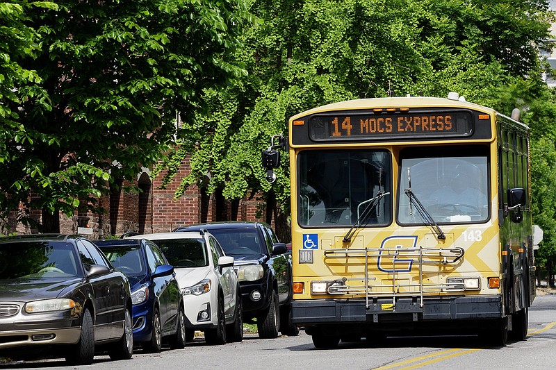 Staff photo by C.B. Schmelter / A Mocs Express CARTA bus rolls along Vine Street on Friday, April 30, 2021 in Chattanooga, Tenn.