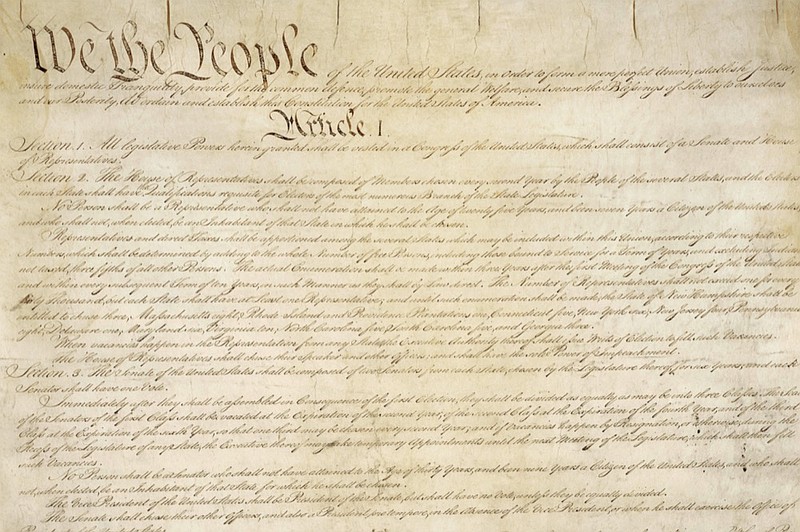 This photo made available by the U.S. National Archives shows a portion of the first page of the United States Constitution. (National Archives via AP)


