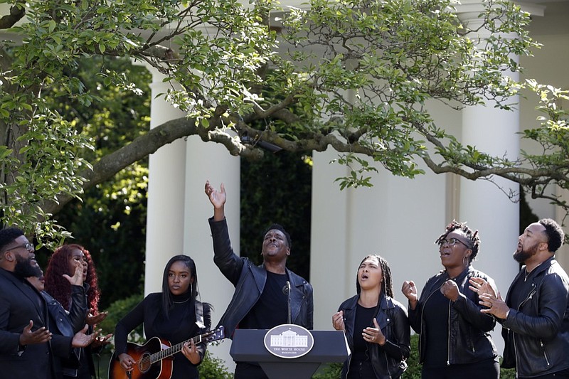 FILE - In this Thursday, May 7, 2020 file photo, The Spirit of Faith Christian Center Choir sings during a White House National Day of Prayer service in the Rose Garden of the White House in Washington. U.S. soldiers were fighting in Korea when President Harry S. Truman signed a Congressional resolution calling for an annual National Day of Prayer. The purpose was for the public to gather in houses of worship to pray for world peace, according to an Associated Press report from April 17, 1952. (AP Photo/Alex Brandon)