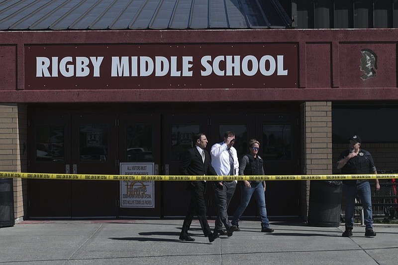 Officers leave Rigby Middle School after a shooting in Rigby, Idaho on Thursday, May 6, 2021. (John Roark /The Idaho Post-Register via AP)


