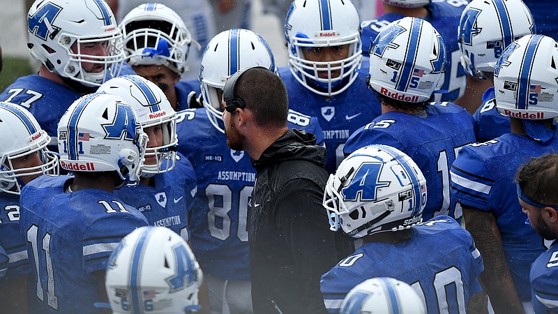 Assumption Athletic Communications photo / Former Assumption offensive coordinator Tommy Galt, center, has joined the UTC football staff as offensive line coach, filling a vacancy that opened four months ago.