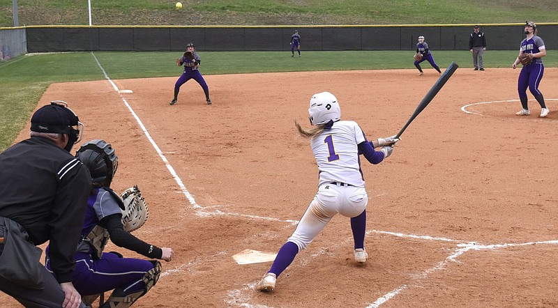 Staff photo by Robin Rudd / Sequatchie County's Ella Edgmon watches her triple sail over Marion County third baseman Emmie Sneed and land just in play during a game in April 2019. Edgmon has adjusted her swing to allow more power this season.