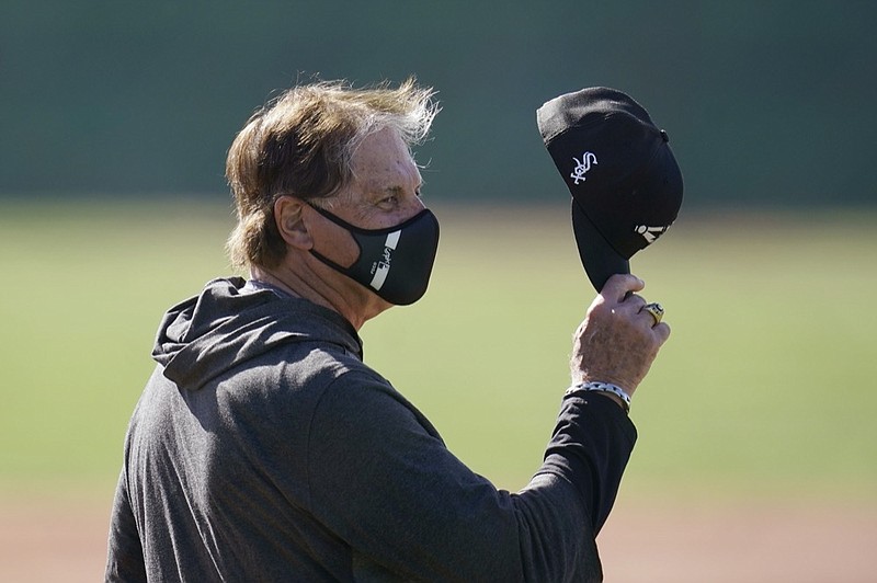 Chicago White Sox manager Tony LaRussa waves his cap as he talks to someone during a spring training baseball practice Wednesday, Feb. 24, 2021, in Phoenix. (AP Photo/Ross D. Franklin)


