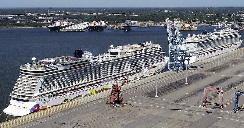 In this May 4, 2020 file photo, Norwegian cruise ships are docked at Portsmouth Marine Terminal in Portsmouth, Va. Norwegian Cruise Lines is threatening to skip Florida ports because of the governor's order banning businesses from requiring that customers be vaccinated against COVID-19. The company says Gov. Ron DeSantis' order conflicts with guidelines from federal health authorities that would let cruise ships sail in U.S. waters if passengers and crew members are vaccinated. (Stephen M. Katz/The Virginian-Pilot via AP, File)