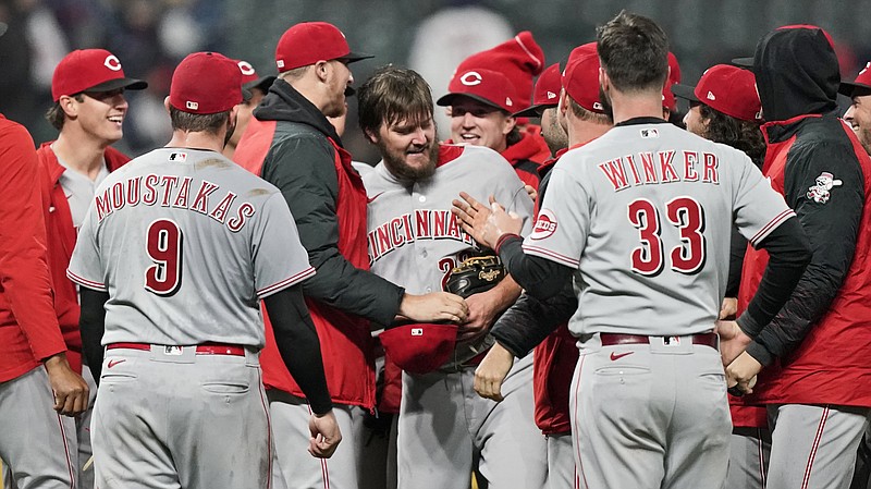 AP photo by Tony Dejak / Cincinnati Reds left-hander Wade Miley, center, is congratulated by his teammates after he pitched a no-hitter Friday night against the host Cleveland Indians. He became the fourth pitcher to throw a no-hitter with MLB's 2021 season a little more than a month old.