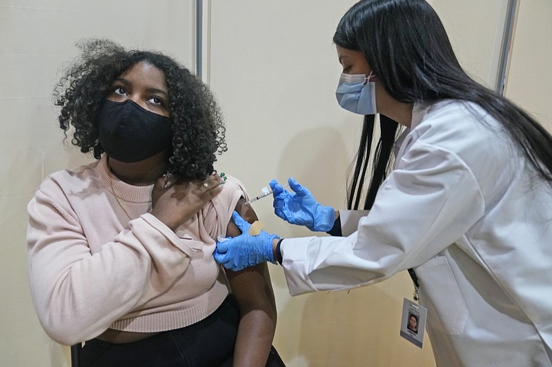 FILE - In this April 19, 2021, file photo, Keidy Ventura, 17, receives her first dose of the Pfizer COVID-19 vaccine in West New York, N.J. (AP Photo/Seth Wenig, File)


