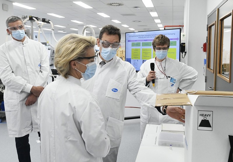 FILE - In this Friday, April 23, 2021 file photo, European Commission President Ursula von der Leyen, second left, speaks with Pfizer CEO Albert Bourla, center right, during an official visit to the Pfizer pharmaceutical company in Puurs, Belgium. (John Thys/Pool via AP, File)


