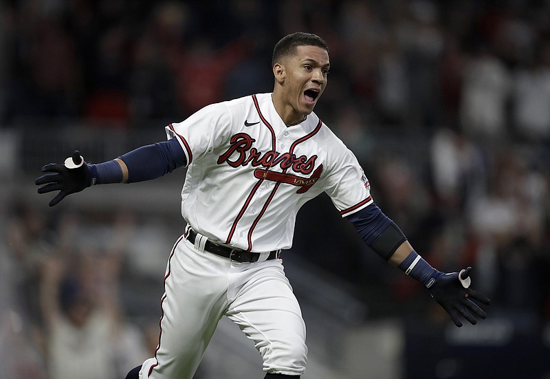 AP photo by Ben Margot / Ehire Adrianza celebrates after driving in the winning run in the 12th inning of the Atlanta Braves' 8-7 victory against the visiting Philadelphia Phillies on Saturday night.