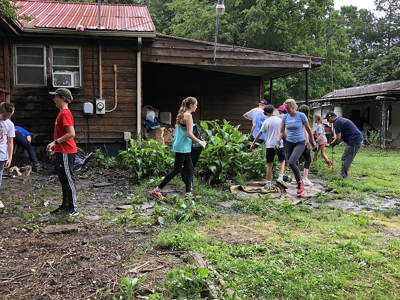 Photo contributed by Walker County Government / Volunteers from P52 help clean up a property in Walker County.