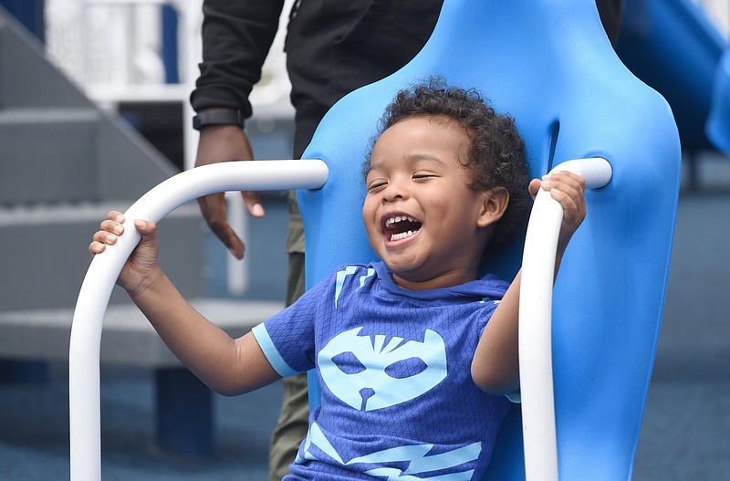 Staff Photo by Matt Hamilton / Nicholas Griffin, 4, laughs as he spins in a chair at the new BlueCross Healthy Place at Highland Park in Chattanooga on Monday, May 10, 2021.