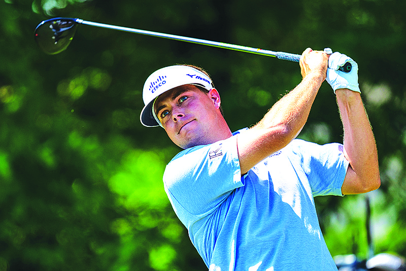 Keith Mitchell tees off on the seventh hole during the fourth round of the Wells Fargo Championship golf tournament at Quail Hollow on Sunday, May 9, 2021, in Charlotte, N.C. (AP Photo/Jacob Kupferman)