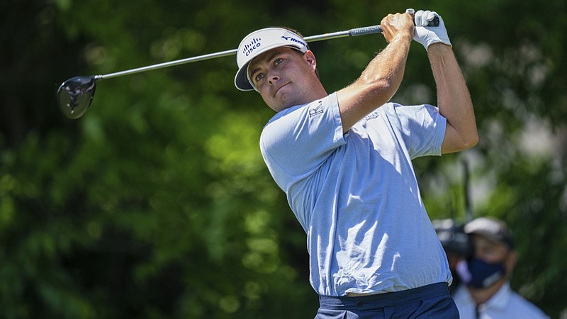 Keith Mitchell tees off on the seventh hole during the fourth round of the Wells Fargo Championship golf tournament at Quail Hollow on Sunday, May 9, 2021, in Charlotte, N.C. (AP Photo/Jacob Kupferman)