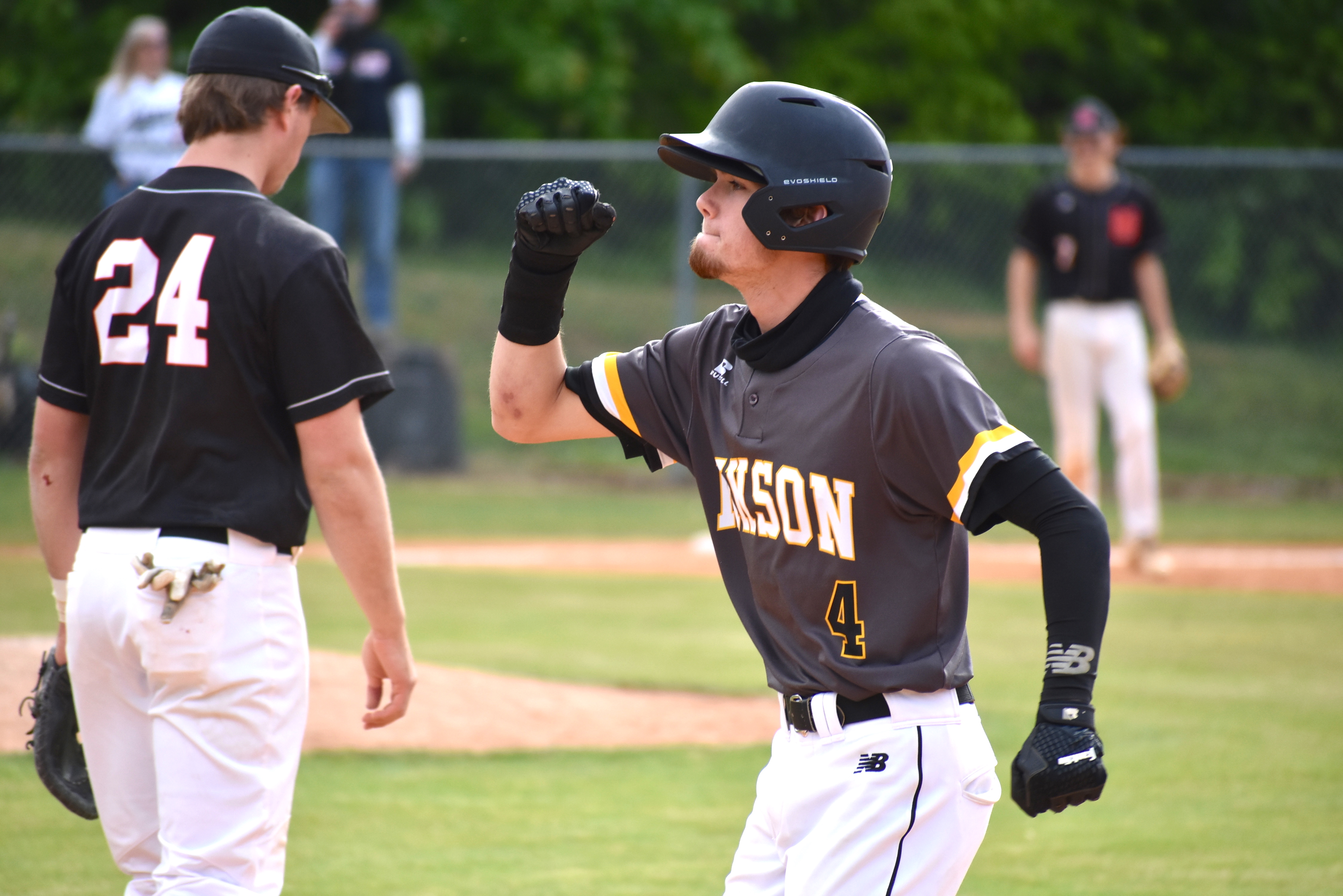 Staff photo by Patrick MacCoon / Hixson senior A.J. Wild celebrates an RBI hit during Wednesday's District 6-AA championship round against Signal Mountain.