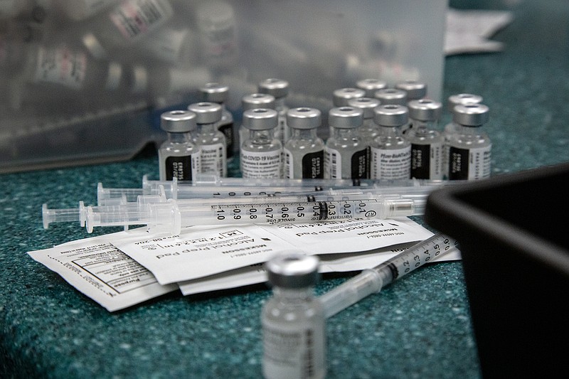 Doses of the Pfizer coronavirus vaccine are seen being prepared on Wednesday, May 12, 2021, in Decatur, Ga. Hundreds of children, ages 12 to 15, received the Pfizer vaccine at the DeKalb Pediatric Center, just days after it was approved for use within their age group. (AP Photo/Ron Harris)