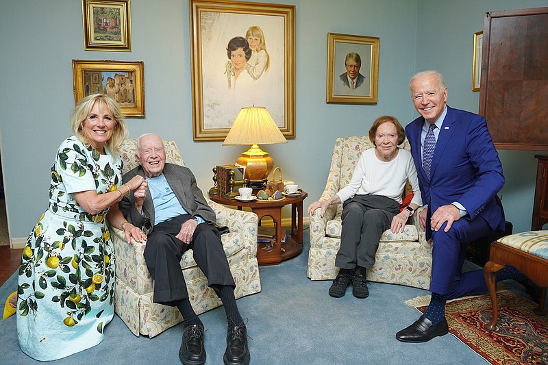 Photo by Adam Schultz, The White House, via The Associated Press / In this April 30, 2021, photo released by The White House, former President Jimmy Carter and former first lady Rosalynn Carter pose for a photo with President Joe Biden and first lady Jill Biden at the home of the Carters in Plains, Georgia.