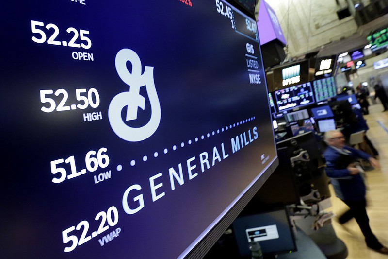 FILE - In this Feb. 23, 2018 file photo, the logo for General Mills appears above a trading post on the floor of the New York Stock Exchange. General Mills is diving further into the red-hot pet food market, acquiring Tyson Foods' pet treat business for $1.2 billion in cash, the companies said Friday, May 14, 2021. (AP Photo/Richard Drew, File)